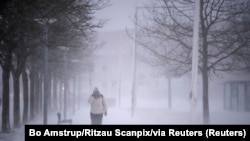A person walks amid heavy snowfall in Randers, Denmark, Jan. 3, 2024. (Bo Amstrup/Ritzau Scanpix via Reuters)
