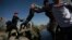 Migrants cross the Rio Grande river into the United States from Ciudad Juarez, Mexico, March 29, 2023. The image was part of a series by Associated Press photographers that won the 2024 Pulitzer Prize for feature photography.