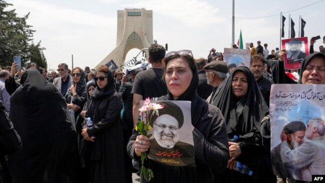 Mourners attend the funeral of Iran's President Ebrahim Raisi at Azadi square in Tehran, Iran, May 22, 2024.