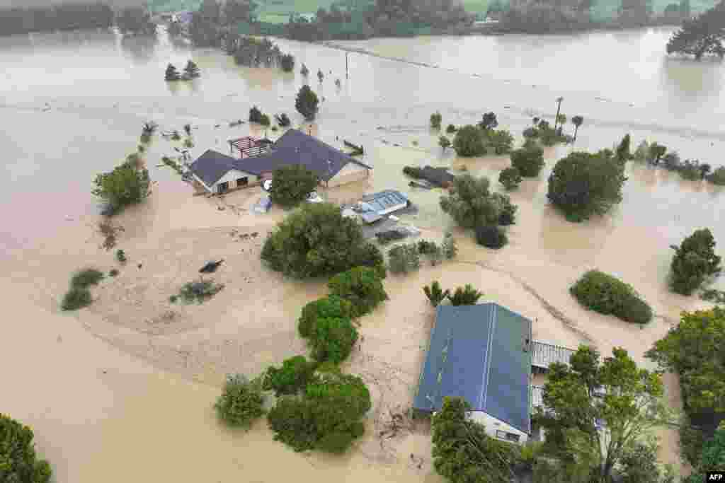 An aerial photo shows flooding caused by Cyclone Gabrielle in Awatoto, near the city of Napier.&nbsp;New Zealand declared a national state of emergency as Cyclone Gabrielle swept away roads, inundated homes and left more than 100,000 people without power.&nbsp;