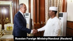 Russia's Foreign Minister Sergei Lavrov shakes hands with Chad's President Mahamat Idriss Deby during a meeting in N'djamena, Chad, June 5, 2024. 