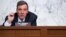 FILE - Senator Mark Warner, Democrat of Virginia and Chairman of the Senate Select Committee on Intelligence, holds a hearing n Capitol Hill in Washington, Apr. 14, 2021.