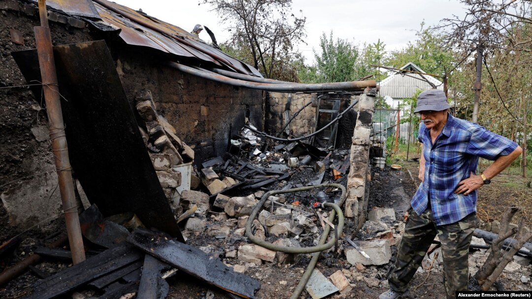 Local resident Vladislav Driga, 75, stands next to the ruins of his outbuilding destroyed by recent shelling in Donetsk, Russian-controlled Ukraine, Sept. 1, 2023. (Alexander Ermochenko/Reuters)