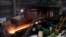 FILE - Red-hot steel rolls along a conveyor inside a mill in Yingkou, China, on July 24, 2019. Indicators suggest that the demand for steel in China will significantly decrease, but some are "cautiously optimistic" that the downturn will be slighter.