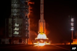 A Long March rocket carrying a crew of Chinese astronauts in a Shenzhou-18 spaceship blast off at the Jiuquan Satellite Launch Center in northwestern China, April 25, 2024.