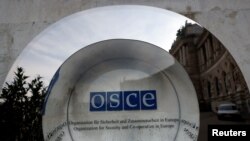 FILE - A sign of the Organization for Security and Cooperation in Europe (OSCE) is pictured outside their headquarters in Vienna, Austria Feb. 15, 2022.