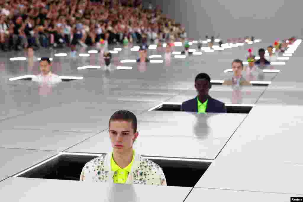 Models present creations by designer Kim Jones as part of his Menswear ready-to-wear Spring/Summer 2024 collection show for fashion house Dior Homme during Men's Fashion Week in Paris.