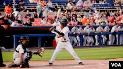 Dennis Kasumba gets a hit during his second game with the Frederick Keys Baseball team at Harry Grove Stadium in Frederick, Maryland on June 3, 2023. (Arzouma Kompaore/VOA)