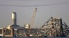 A crane is seen near the wreckage of the Francis Scott Key Bridge on March 29, 2024 in Baltimore.