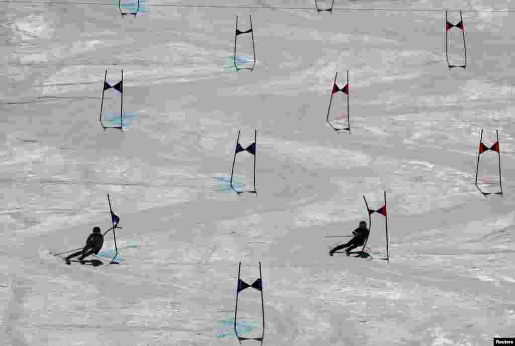 Germany's Lena Duerr and Italy's Marta Bassino compete during the mixed team parallel quarter final heat 2, in the FIS Alpine Ski World Cup, in Soldeu, Andorra.