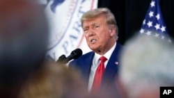 FILE - Former President Donald Trump visits with campaign volunteers, July 18, 2023, in Cedar Rapids, Iowa. Lawyers for Trump, during a hearing on June 21, 2024, in Fort Pierce, Fla., challenged the legality of special counsel Jack Smith’s appointment.