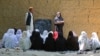 Afghan school girls attend a class at an open air primary school in Khogyani district of Nangarhar province, May 14, 2023. The Taliban banned secondary education for girls after the 2021 takeover.