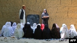 Afghan school girls attend a class at an open air primary school in Khogyani district of Nangarhar province, May 14, 2023. The Taliban banned secondary education for girls after the 2021 takeover.