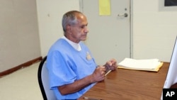 FILE - In this image provided by the California Department of Corrections and Rehabilitation, Sirhan Sirhan sits for a parole hearing in San Diego, California, Aug. 27, 2021.