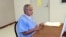 FILE - In this image provided by the California Department of Corrections and Rehabilitation, Sirhan Sirhan sits for a parole hearing in San Diego, California, Aug. 27, 2021.