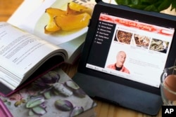 FILE - While many fiction and non-fiction readers might they prefer e-books, the vast majority of cookbook readers prefer print, according to research by the Book Industry Study Group. (AP Photo/Matthew Mead)