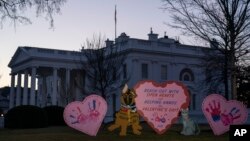 Valentine's Day decorations adorn the White House lawn, Feb. 14, 2023, in Washington.