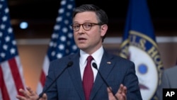 FILE - Speaker of the House Mike Johnson talks with reporters at the Capitol in Washington, April 16, 2024.