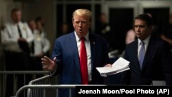 Former U.S. President Donald Trump talks to the media after a day of testimony in his trial at Manhattan Criminal court in New York, May 10, 2024. (Jeenah Moon/Pool Photo via AP)