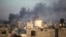 Smoke rises from the town of Khan Younis after Israeli strikes, Dec. 15, 2023. 
