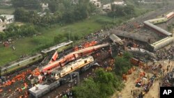 Rescuers work at the site of passenger trains accident, in Balasore district, in the eastern Indian state of Orissa, June 3, 2023. 