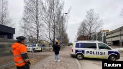 A police cordon stands outside Viertola school in Vantaa, after a shooting took place there earlier in the day, in a suburb of the capital Helsinki, Finland April 2, 2024. 