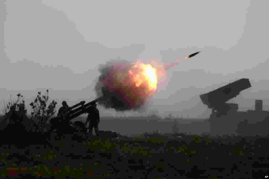Indonesian Marines fire an artillery round during an amphibious landing operation at the Super Garuda Shield multi-national military exercise in Situbondo, East Java, Indonesia.