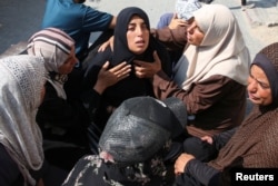 The mother of Kamel Ghabayen, a Palestinian who was detained by Israel and is said to have been killed in an Israeli strike upon his release, reacts at Nasser hospital, in Khan Younis in the southern Gaza Strip, July 7, 2024.