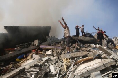 Palestinians look for survivors of the Israeli bombardment of the Gaza Strip in Rafah, Oct. 23, 2023.