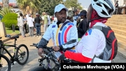 Jacob Mafume, the mayor of Harare, talks to a reporter before leaving the Town House on bicycle, June 1, 2024.