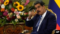 Venezuela's President Nicolas Maduro points while meeting Colombia's new ambassador to Venezuela, at the Miraflores Presidential Palace in Caracas, Venezuela, Aug. 16, 2023. 