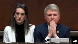 FILE - House Foreign Affairs Committee Chair Rep. Michael McCaul, R-Texas, right, on Capitol Hill in Washington, April 19, 2023. 
