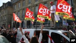 CGT union members demonstrate against French President Emmanuel Macron's push to raise France's retirement age from 62 to 64, at a march in Bordeaux, southwestern France, March 28, 2023.