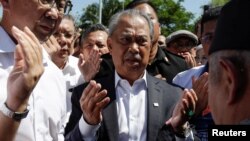 Former Malaysia Prime Minister Muhyiddin Yassin arrives to give a statement to the Malaysian Anti-Corruption Commission (MACC) in Putrajaya, Malaysia, March 9, 2023. 