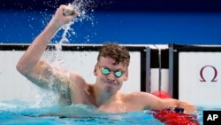 Leon Marchand of France celebrates after winning the men's 200-meter breaststroke final at the 2024 Summer Olympics, July 31, 2024, in Nanterre, France.