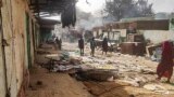 FILE - People walk among scattered objects in the market of El Geneina, the capital of West Darfur, on April 29, 2023. The fighting between the Sudan army and the paramilitary Rapid Support Forces continues to spread, with Darfur and other places now battlefields.