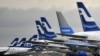 FILE - Passenger planes of the Finnish national airline company Finnair stand on the tarmac at Helsinki international airport.