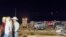 In this image made from video provided by KAMC/KLBK, people stand near debris in Matador, Texas, June 21, 2023, following storms went through the area. (KAMC/KLBK via AP)