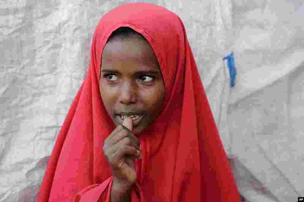 Shukri Mohamed Ibrahim, who fled amid a drought with her family, stands in makeshift camp for displaced people, on the outskirts of Mogadishu, Somalia on Thursday, September 28, 2023. The worst drought in more than 50 years scorched the once-fertile pastures her family relied on, leaving them barren.&nbsp;