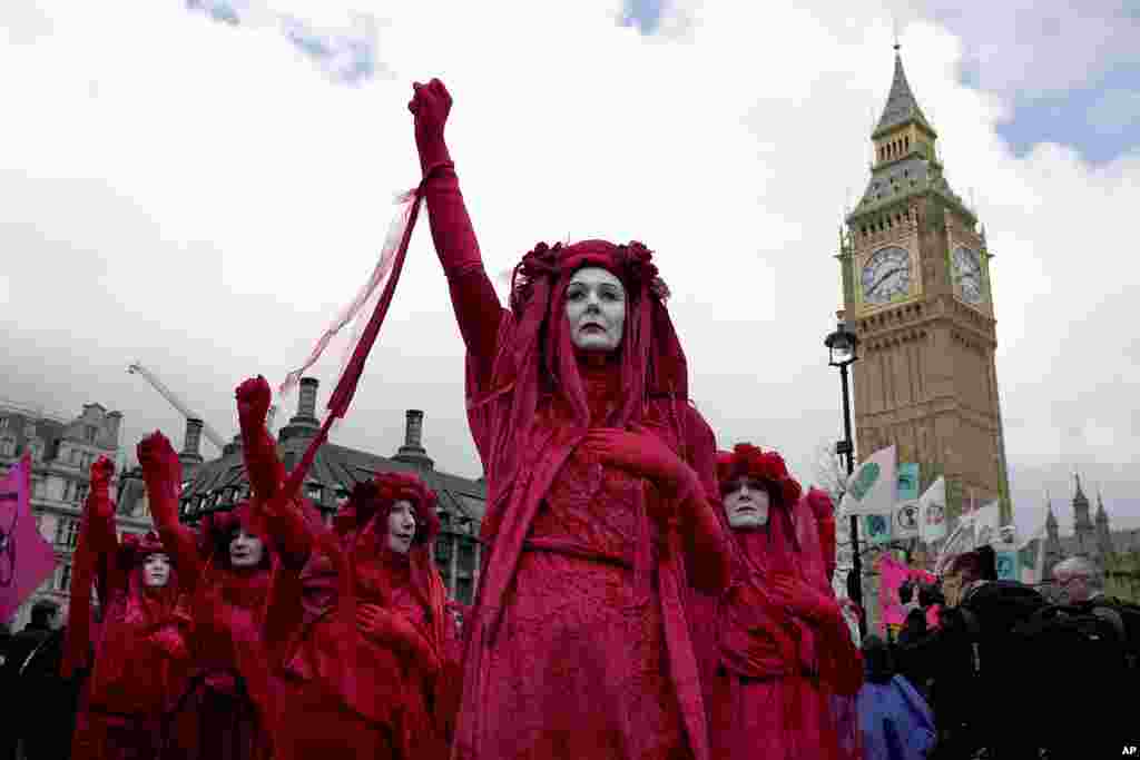 Activists protest outside the Houses of Parliament in London. Extinction Rebellion and other environmental groups are protesting for four days from Friday to Monday, with an event they are calling "The Big One."