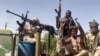 资料照 - 苏丹准军事武装“快速支援力量”2023年4月23日发布的视频截屏。位于大喀土穆地区东尼罗河去的快速支援力量的战斗人员乘坐在一辆架设了高射机枪的“皮卡”上。
