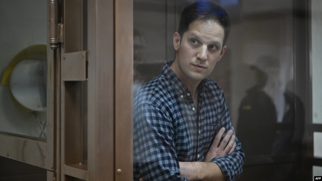 U.S. journalist Evan Gershkovich, arrested on espionage charges, stands inside a defendants' cage before a hearing to consider an appeal on his arrest at the Moscow City Court in Moscow, April 18, 2023
