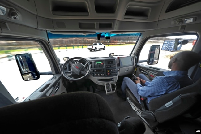 The interior of the cab of a self driving truck is shown as the truck maneuvers around a test track in Pittsburgh, Thursday, March 14, 2024. (AP Photo/Gene J. Puskar)