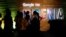 FILE — Participants walk past glowing signs during a conference tagged "Google for Nigeria" in Lagos, Nigeria, July 27, 2017.