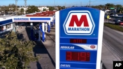 A Marathon gas station is pictured in Bradenton, Florida, Feb. 7, 2024. ConocoPhillips is buying Marathon Oil in an all-stock deal valued at approximately $17.1 billion. 