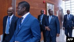 Senegal's President Macky Sall (2nd R) arrives on the second day of the 36th Ordinary Session of the Assembly of the African Union (AU) at the Africa Union headquarters in Addis Ababa, Ethiopia, Feb. 19, 2023.
