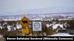 A road sign south of White Mesa, Utah, home to the Ute Mountain Ute Tribe. Utah is among several U.S. states that have banned ballot collection, posing a hardship to some Native American voters.