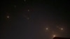 This video grab from AFPTV taken on April 14, 2024 shows explosions lighting up the sky in Hebron in the Israeli-occupied West Bank during an Iranian attack on Israel. 