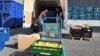 Volunteer for Le Maillon Manuel Pintos loads goods into a vehicle for food distribution, Aug. 6, 2024, during the 2024 Summer Olympics, in Gennevilliers, France. 