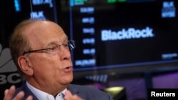 FILE - Larry Fink, Chairman and CEO of BlackRock, speaks during an interview with CNBC on the floor of the New York Stock Exchange (NYSE) in New York City, April 14, 2023. 